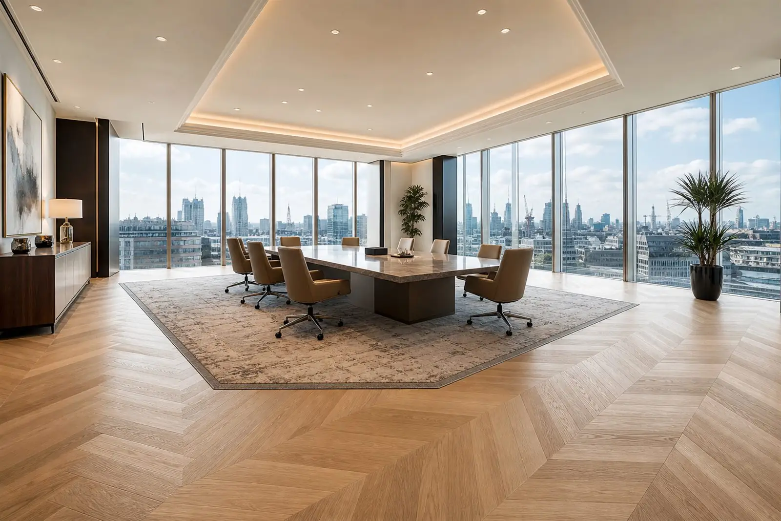Large bright London boardroom with a central patterned rug under the desk and light-oak herringbone wood flooring around it