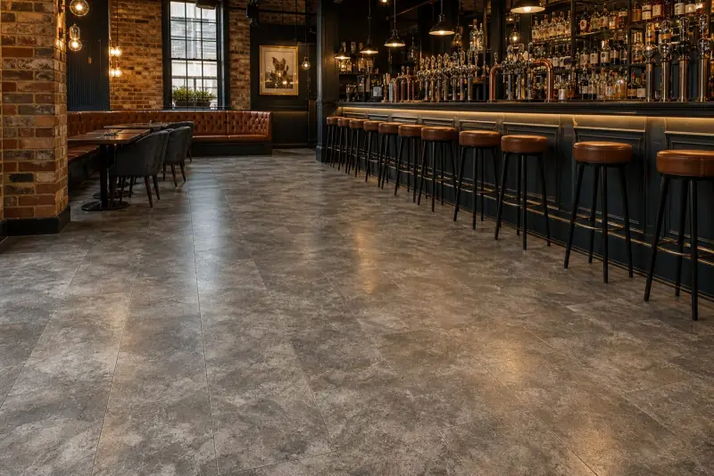 Empty London gastropub interior with a hard-wearing patterned tiled floor by the bar