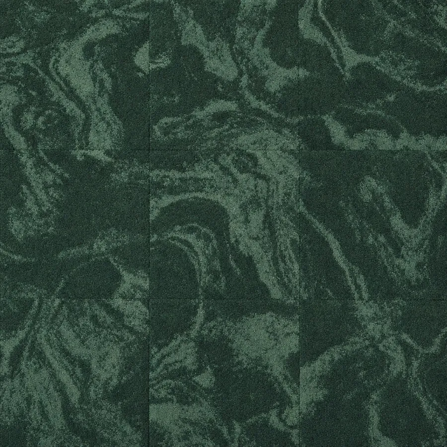 Deep emerald-green commercial carpet tiles with an organic marbled fleck