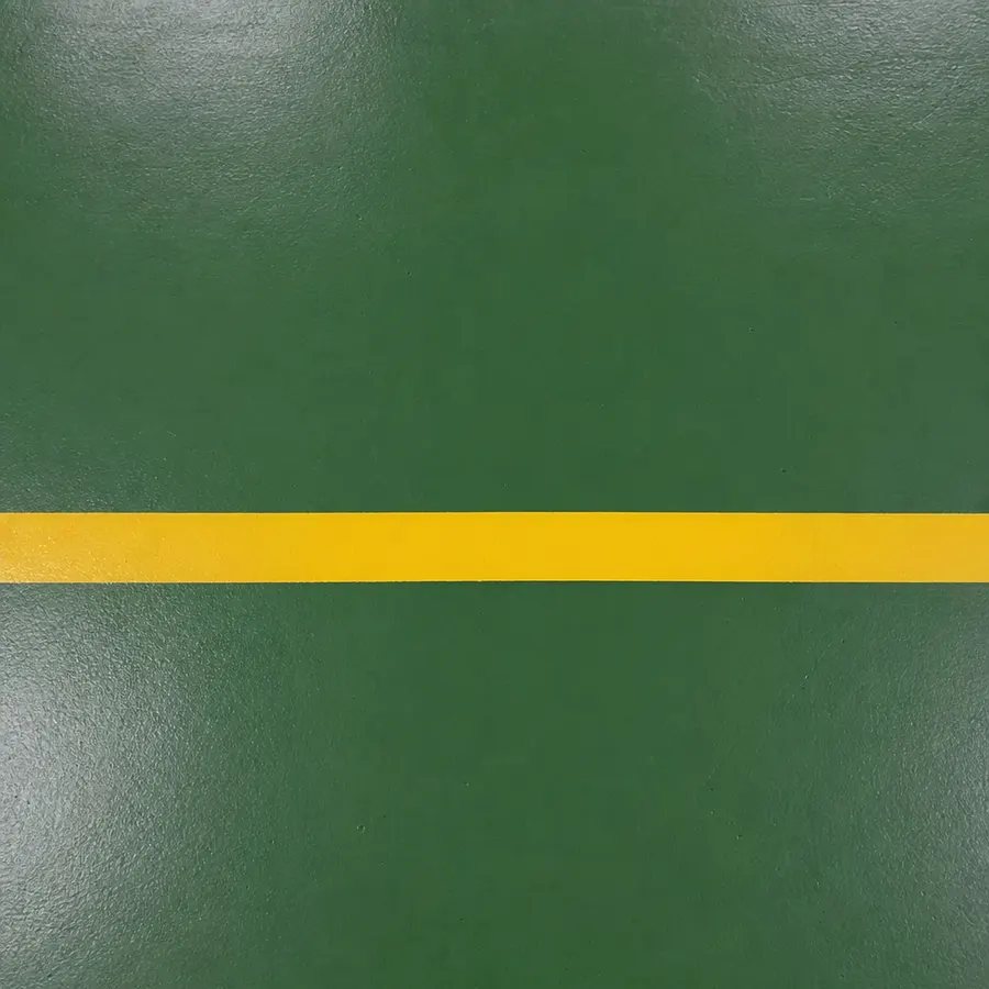 Racing-green polyurethane resin warehouse floor with a yellow safety line
