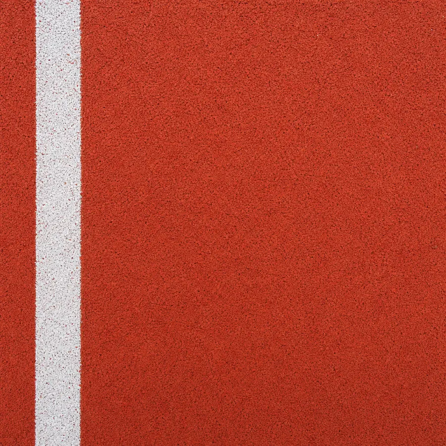 Vermillion-red granular rubber sports flooring with a white boundary line
